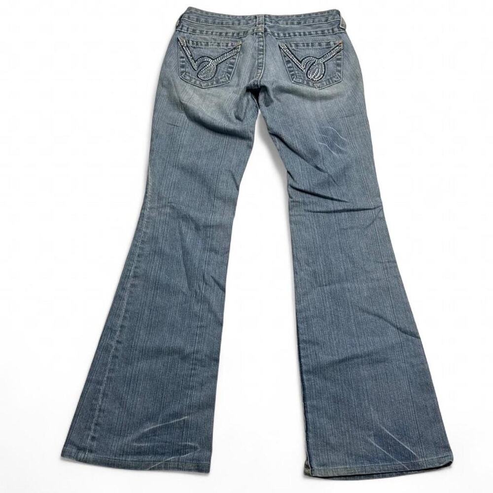 Bebe Early 2000s Low rise flare jeans with a blue wash a unique Mcbling size 28